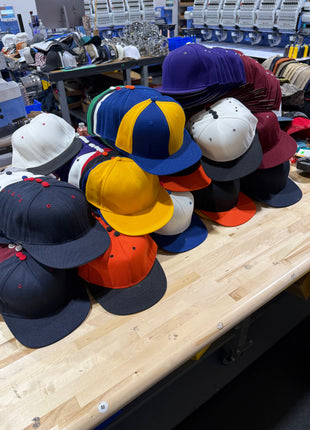 Production 400 fitted custom hats  plus Vintage sports hat lot.