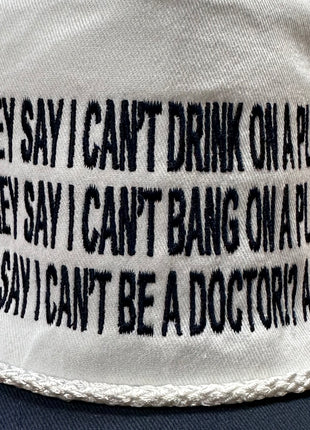 They say I can’t drink on a plane they say I can’t bang on a plane on a white crown navy brim SnapBack hat cap custom embroidered